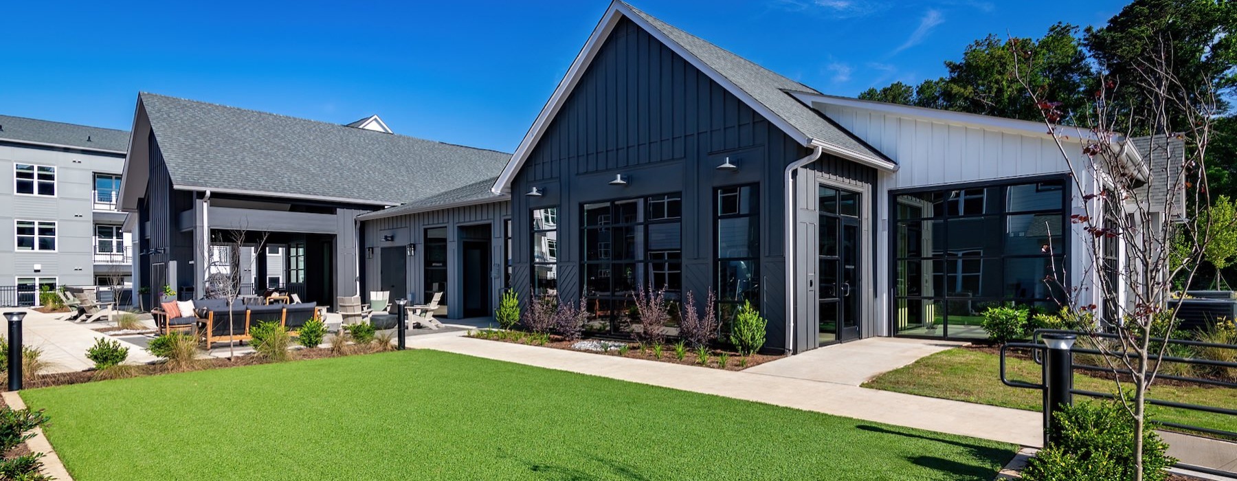 a building with a grassy area