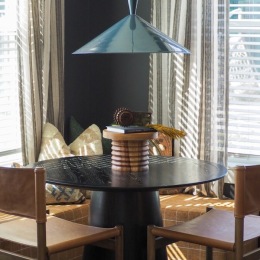 a dining room table with chairs
