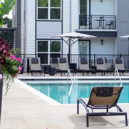 a swimming pool with a lounge chair