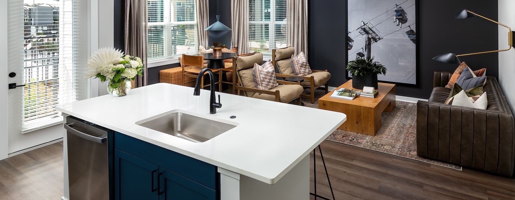 a kitchen with a sink and a couch